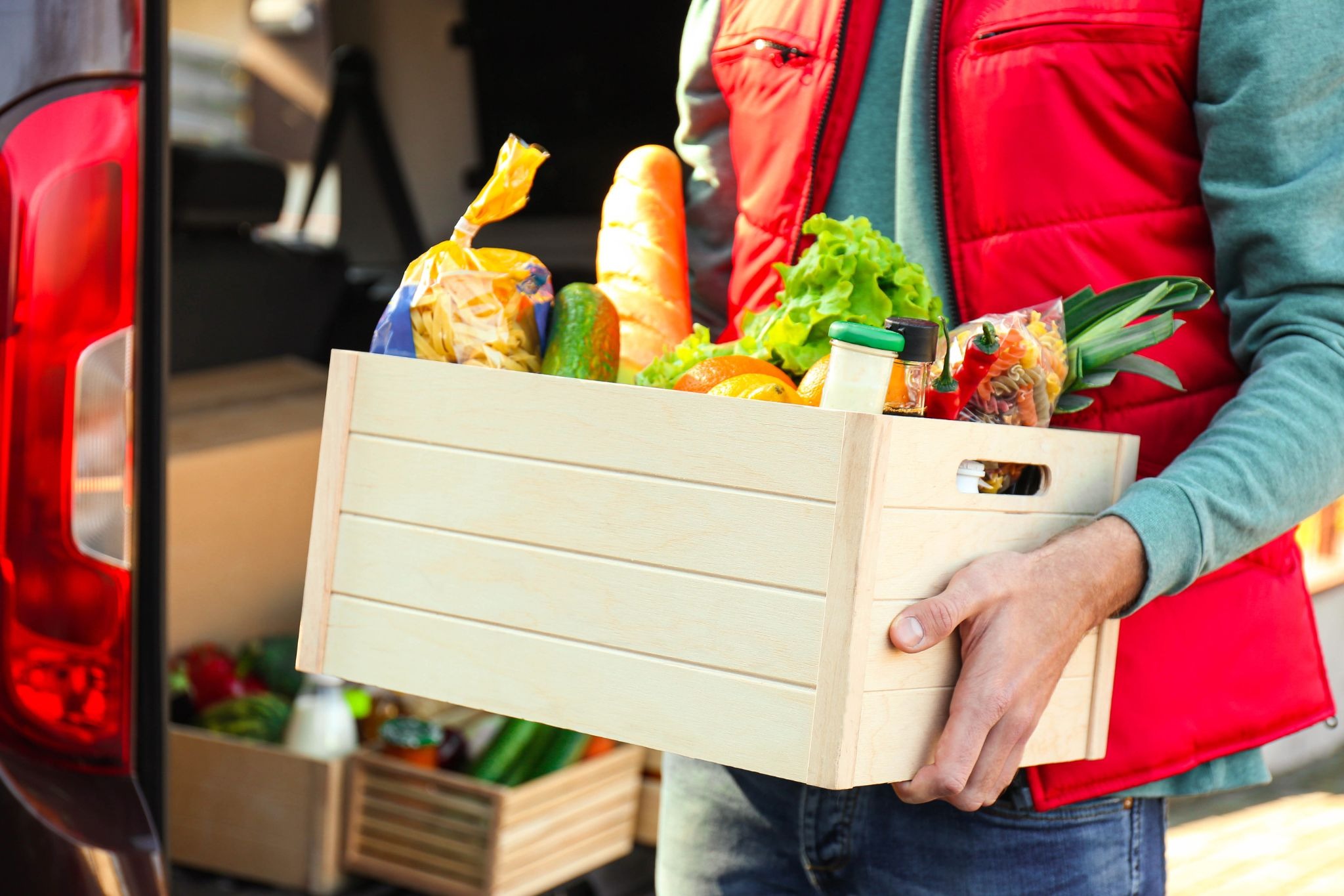 Instacart shopper ready to deliver a box of groceries to the customer