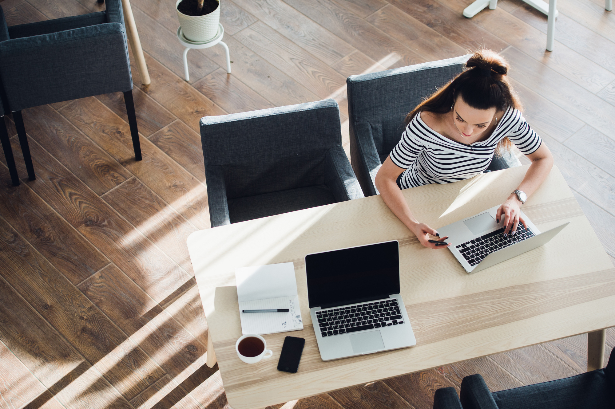 A busy freelancer working in a co-working space