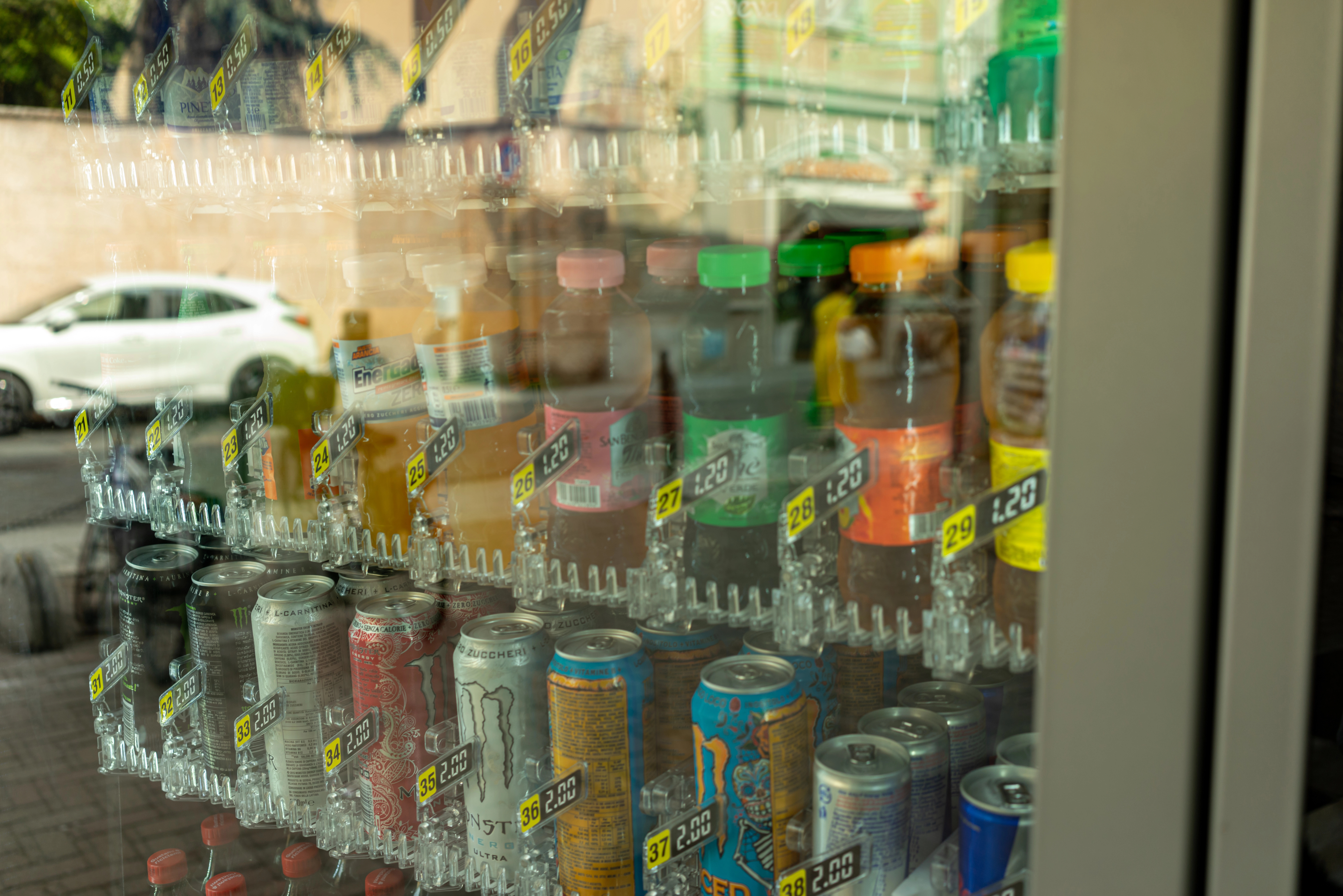 A fridge fully stocked with drinks.