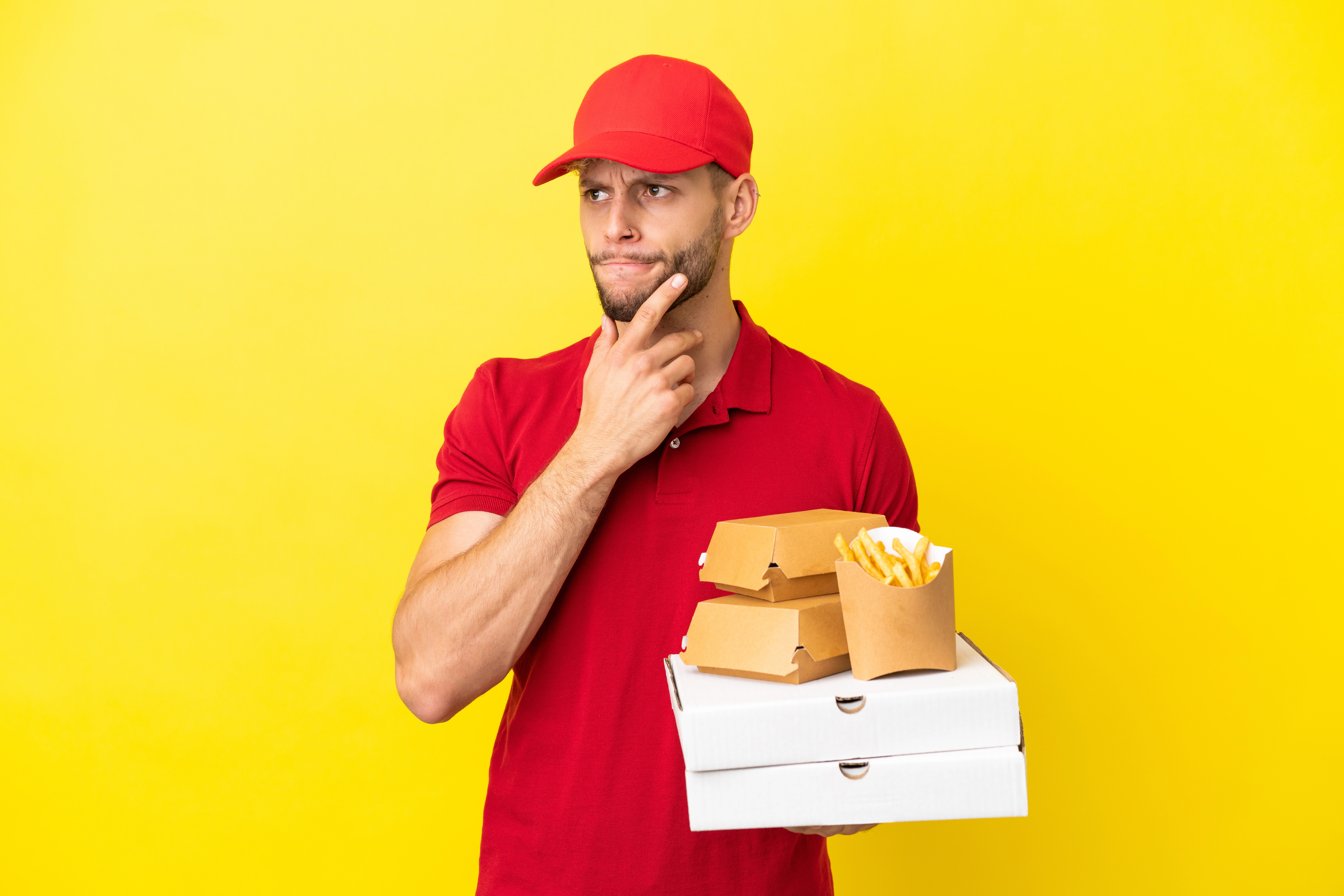 A delivery person thinking