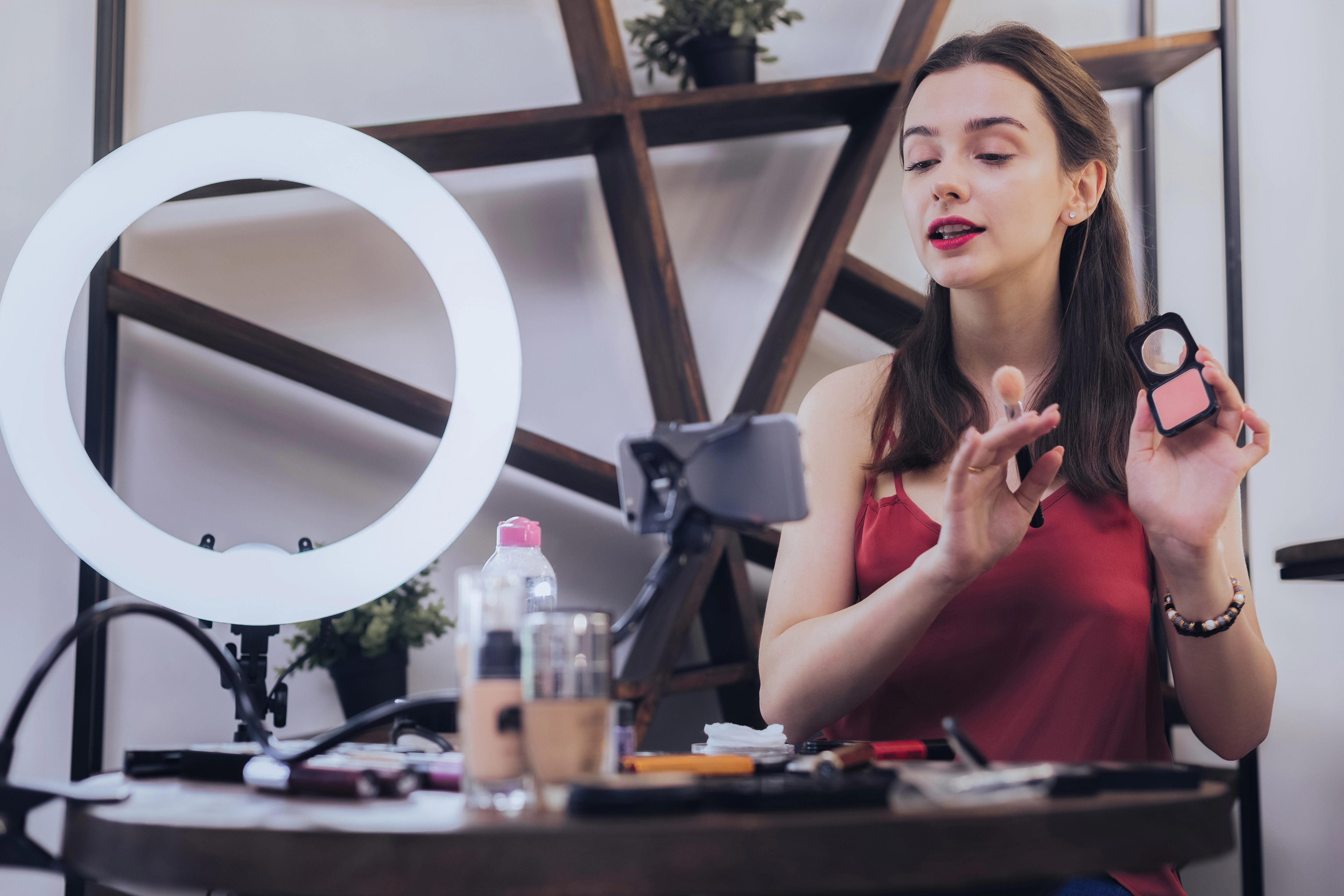 A beauty sales rep showing how to use their products through a live video demo.