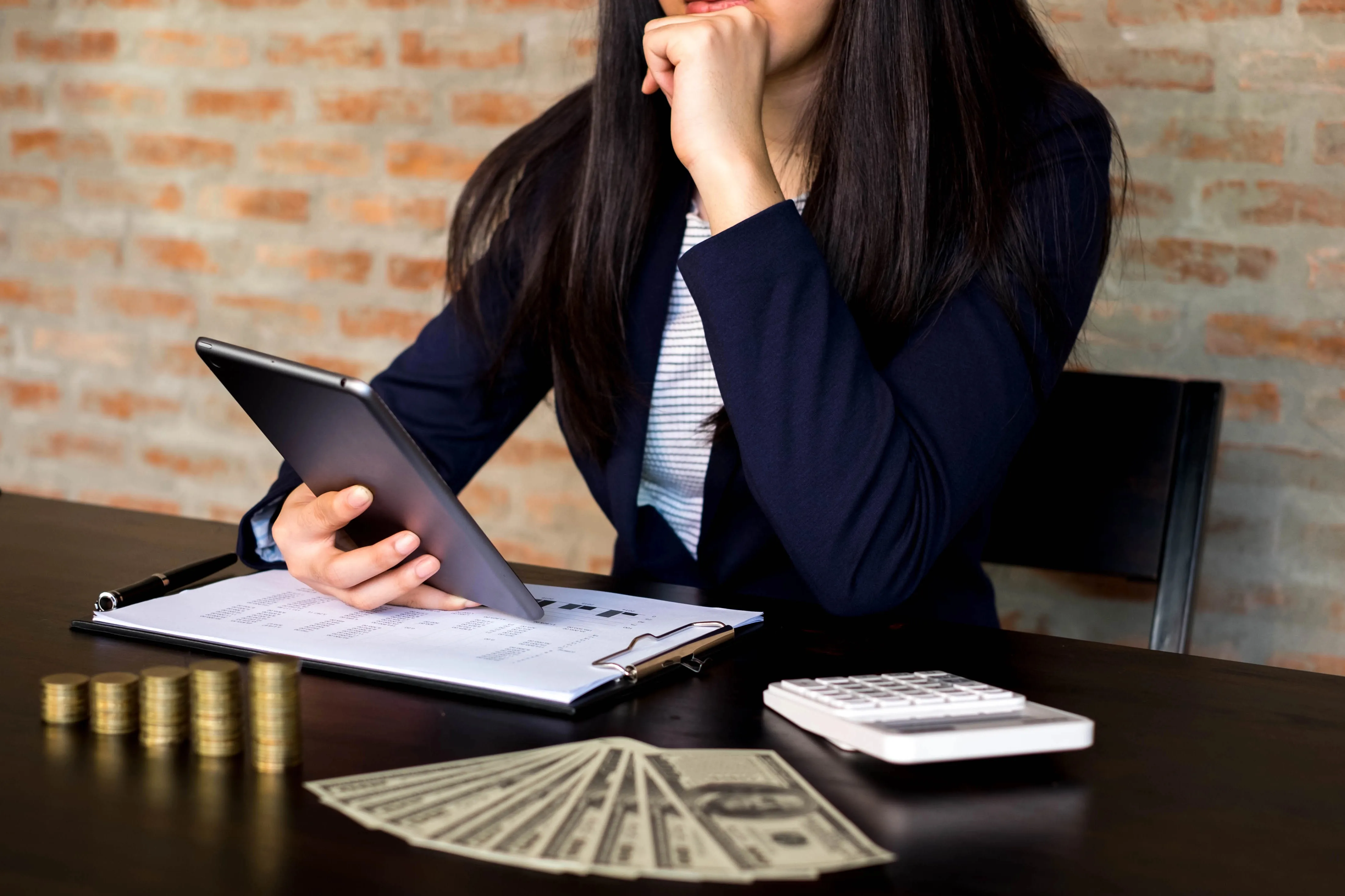 A business owner looking at a tablet