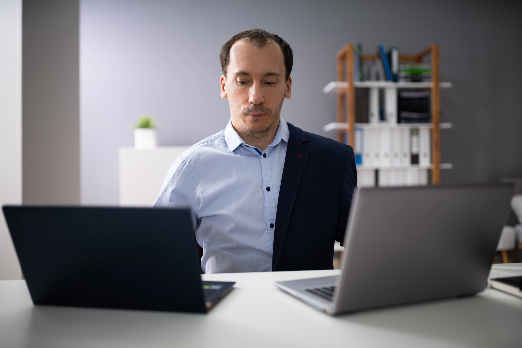a person working two full-time jobs at the same time
