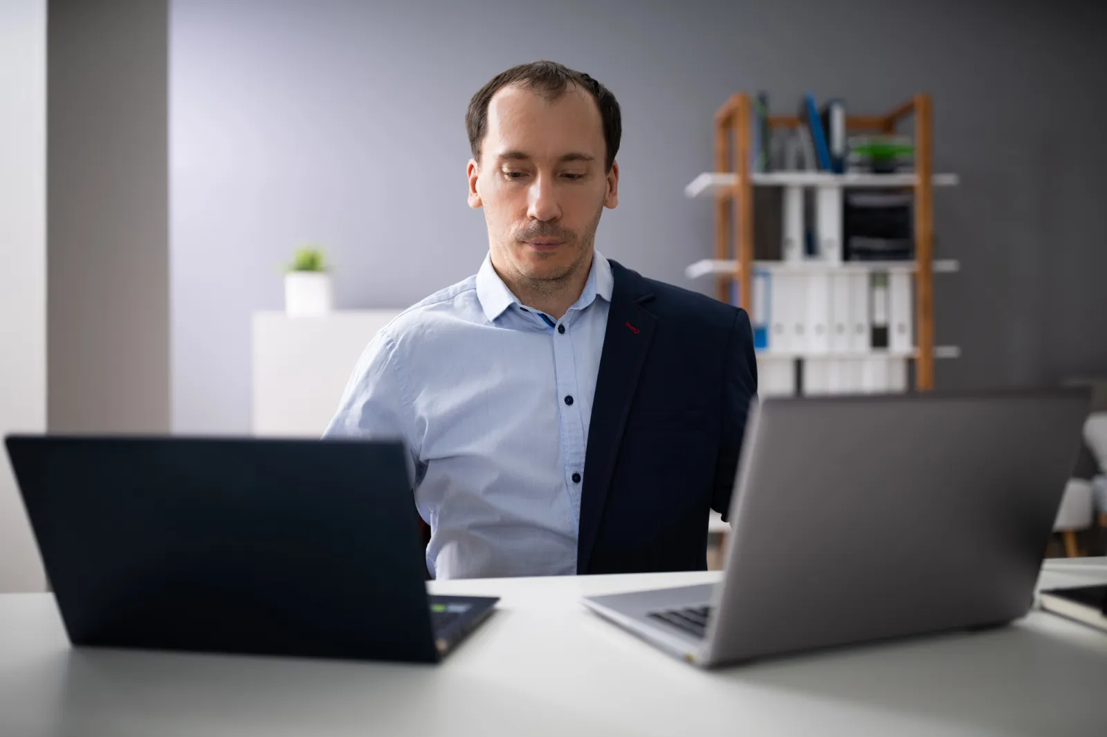 a person working two full-time jobs at the same time