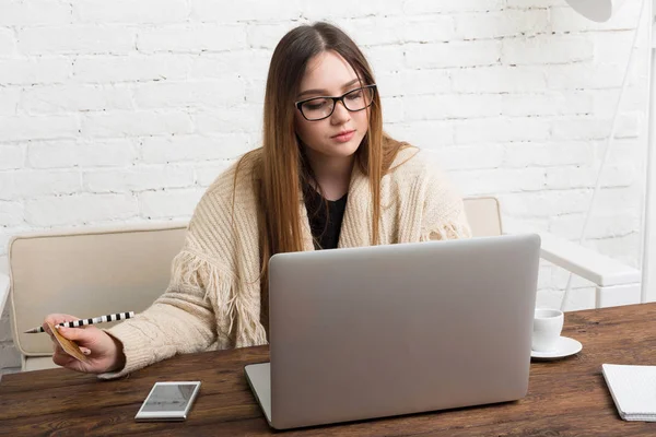 business owner looking at different funding options online