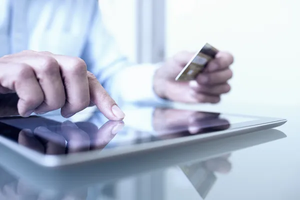 gig worker typing their credit card details in order to make an online purchase