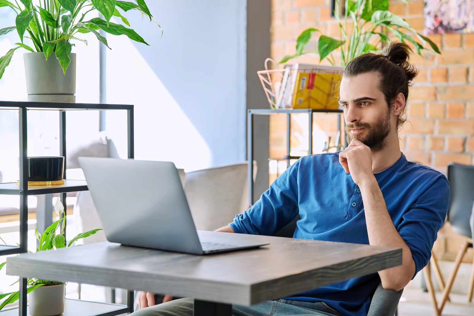 freelancer looking at current job openings online to diversify their income