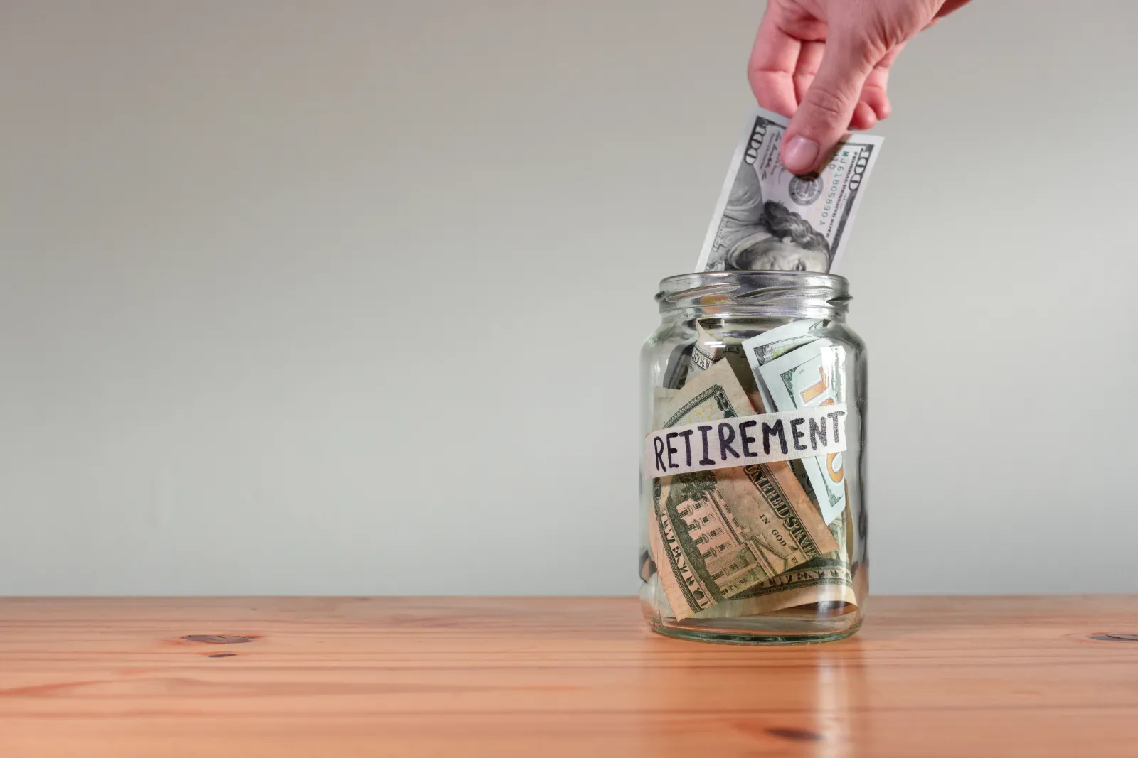 Gig worker contributing income to a retirement savings fund for long-term financial security. 
