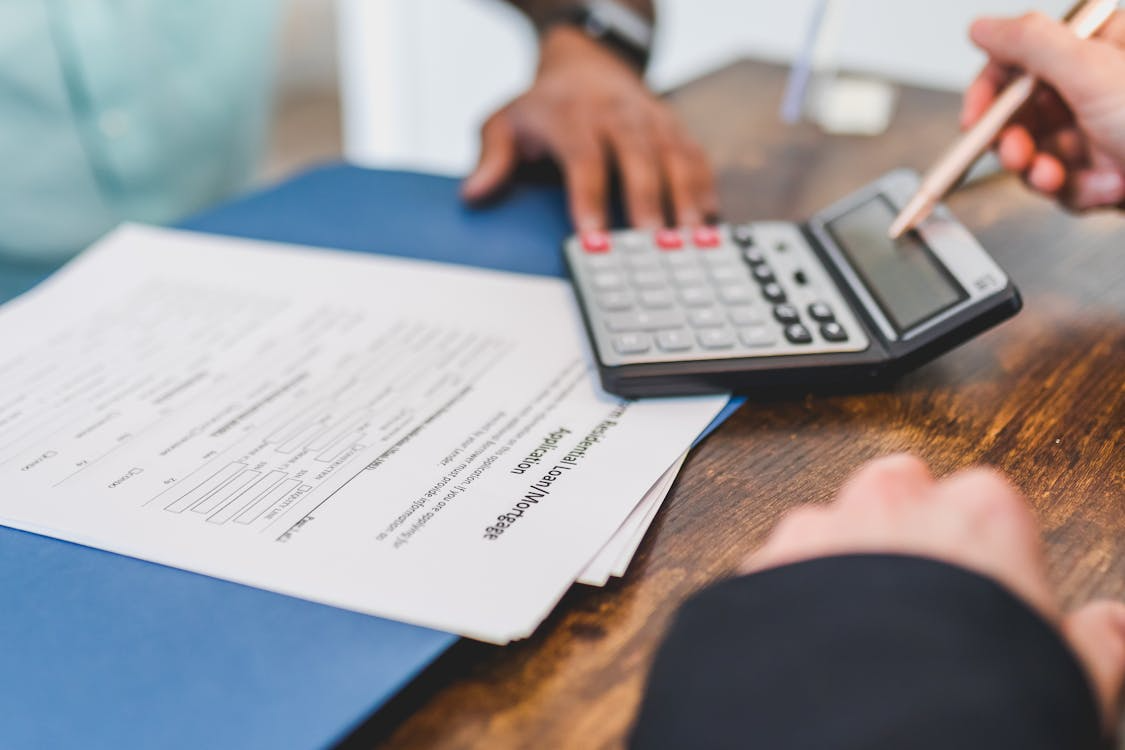  gig worker double checking the total of the loan
