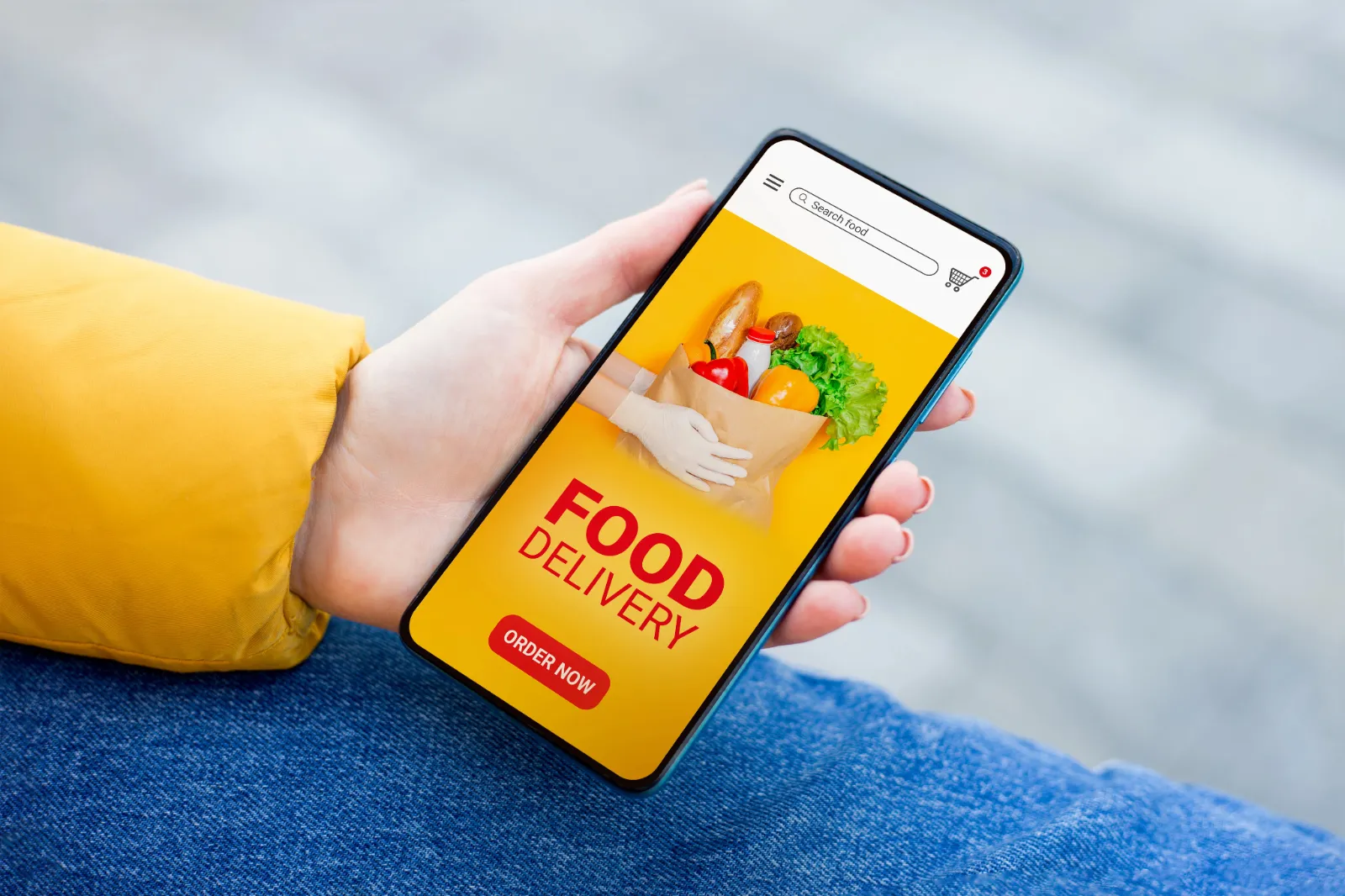 customer using their phone to order and get food delivered 