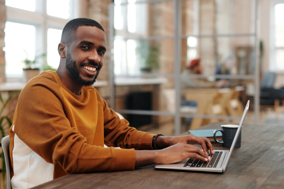 freelancer working comfortably after upgrading their workspace