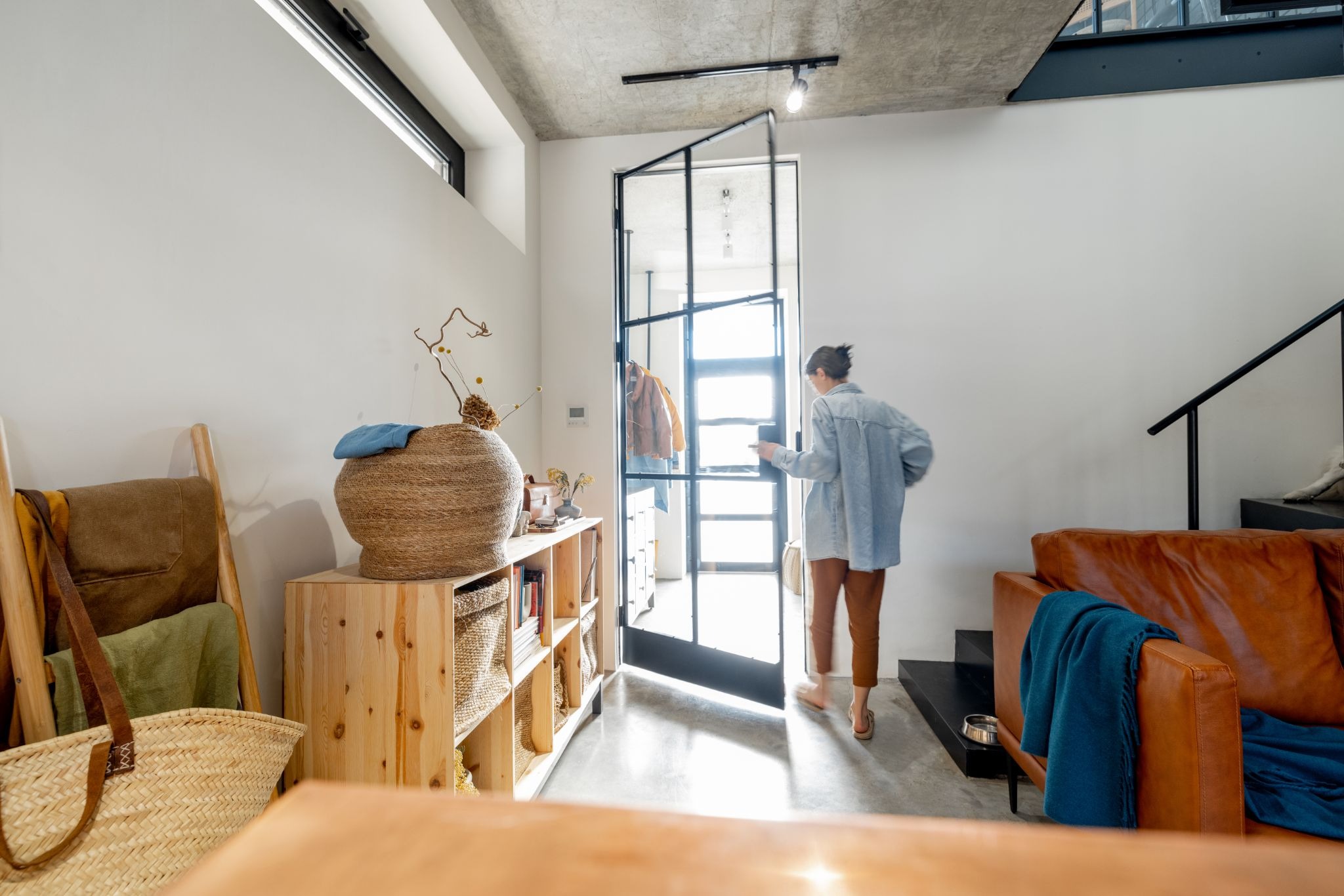 Airbnb guest entering a modern vacation rental home.