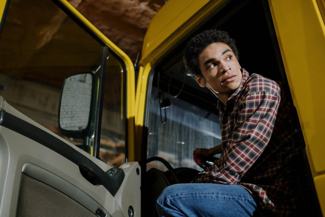 independent trucker sitting inside their parked vehicle