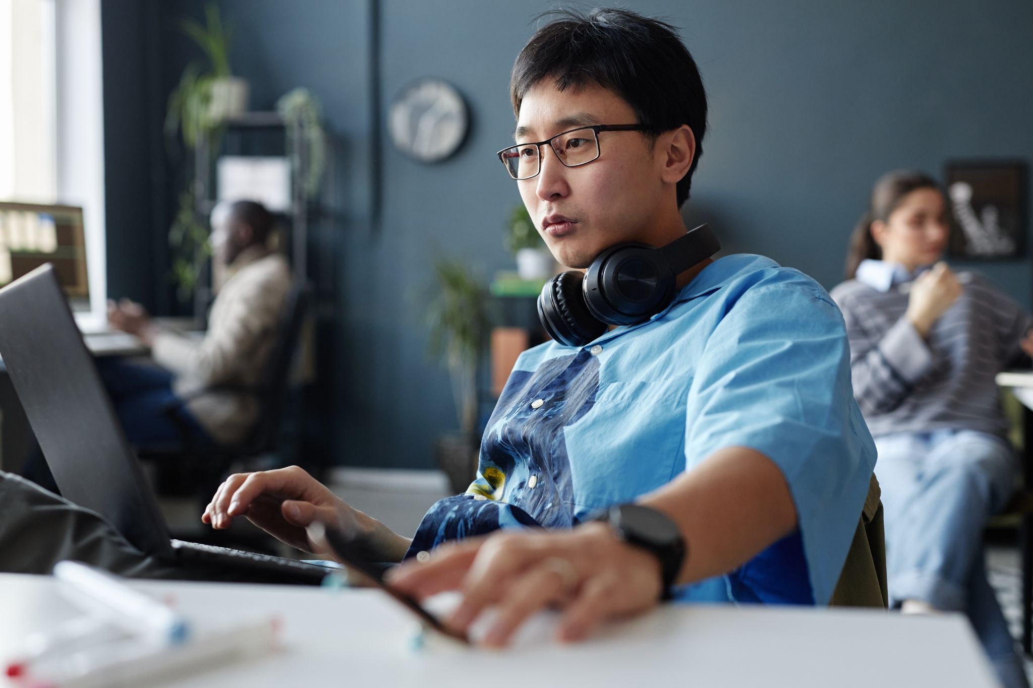 Freelancer taking an online course to build new skills while working from a coworking space