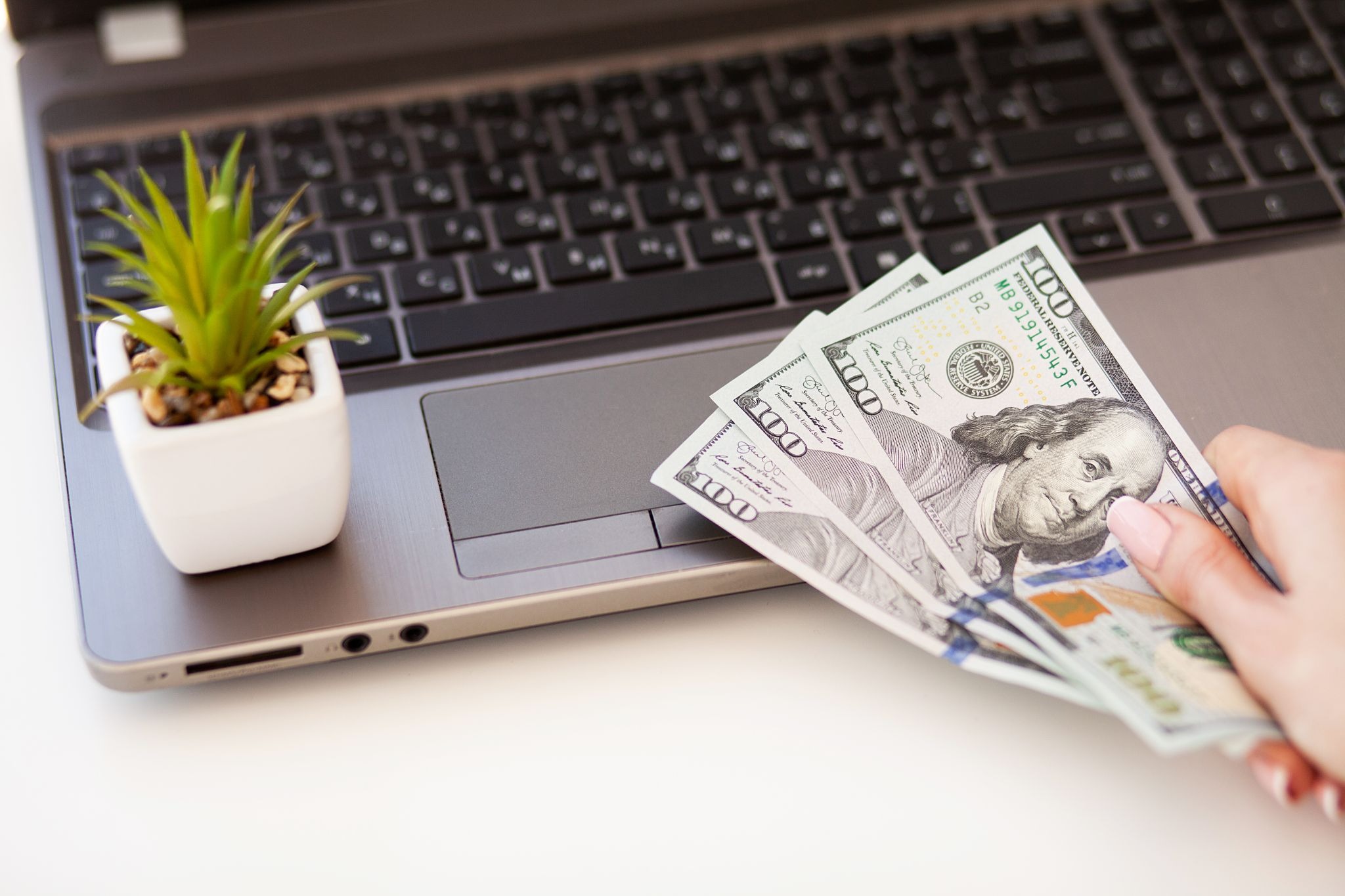 Gig worker reviewing funding options and accessing a loan online to manage business expenses