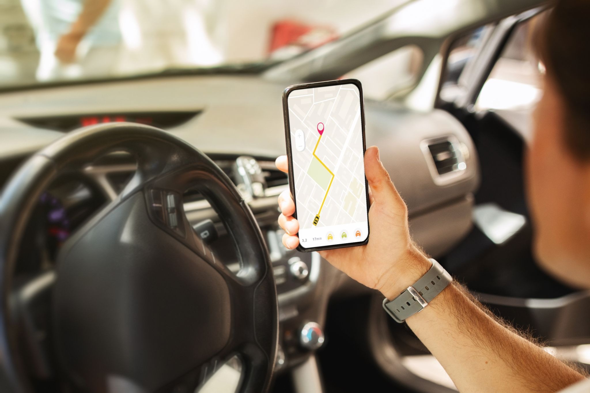  Lyft driver using a navigation app to locate a passenger and plan the fastest route to the destination