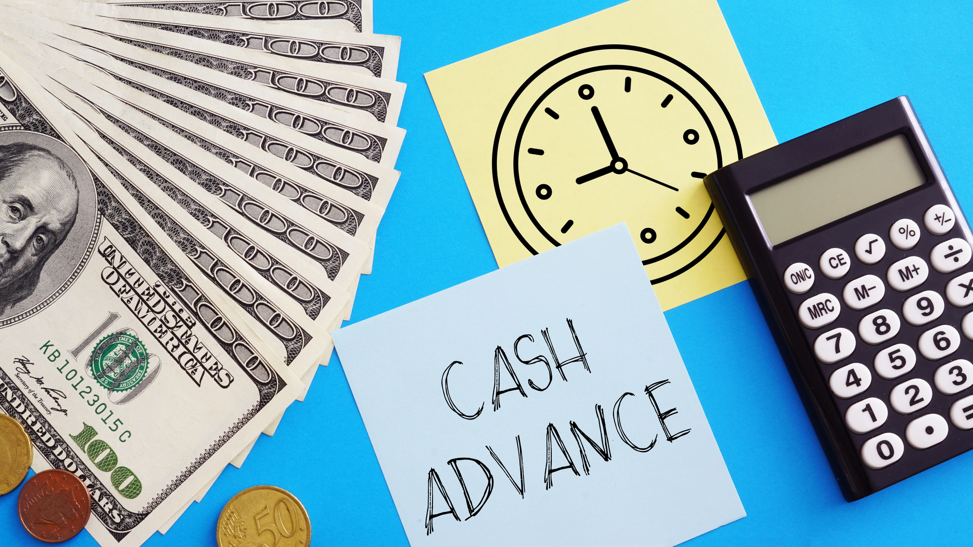 money, paper with a clock drawing, a calculator, and a paper with cash advance text on the table