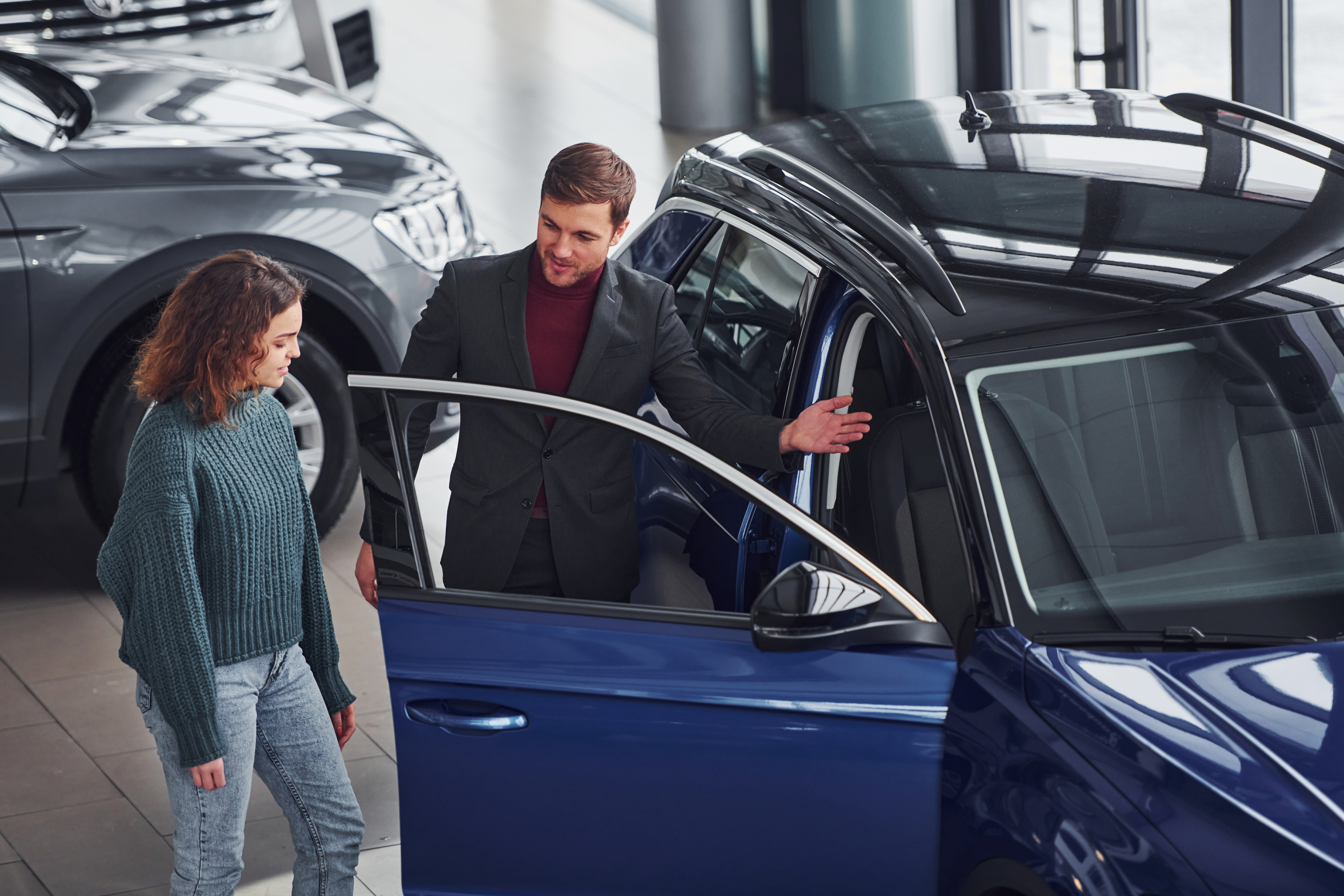 Gig worker exploring the benefits of switching to an electric vehicle to reduce fuel costs and increase long-term earnings.