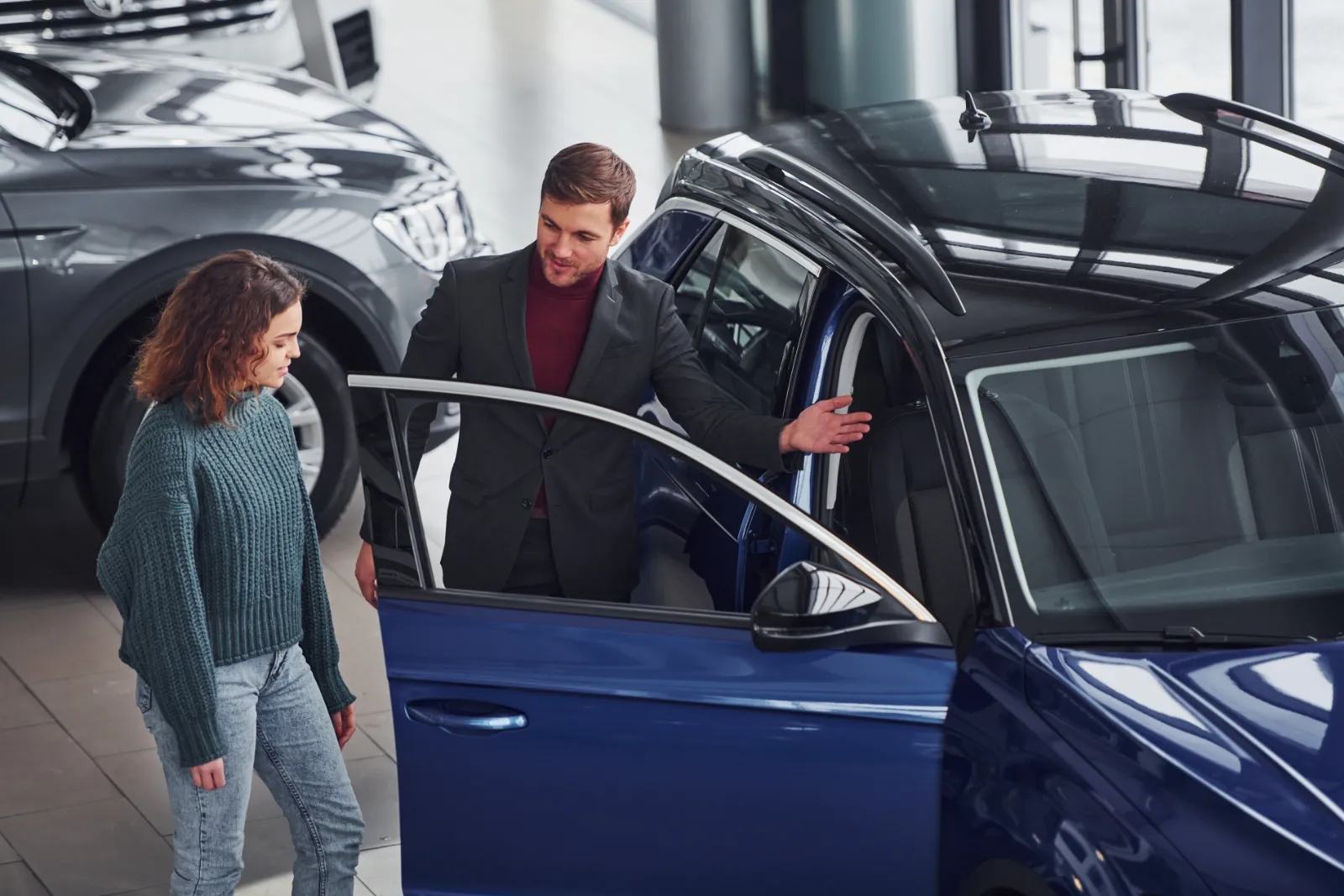 Gig worker exploring the benefits of switching to an electric vehicle to reduce fuel costs and increase long-term earnings.