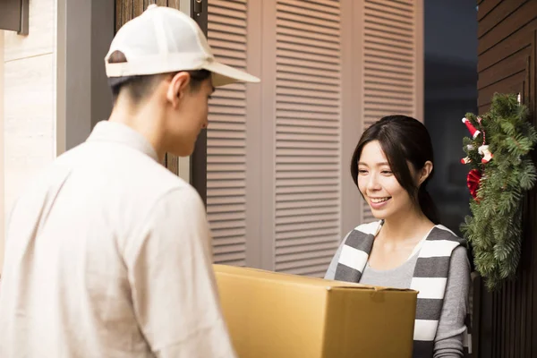  women getting a delivery during Christmas